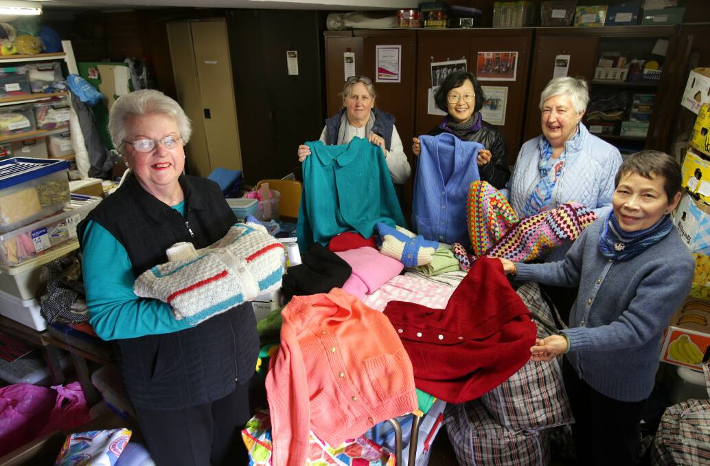 It's a wrap: Volunteers of Gabbies Sewing Angels including Patricia Will (second from right) load up the latest shipment of 10 bags of their hand-made clothes and blankets to send to flood-impacted families in Lismore. Picture: John Veage