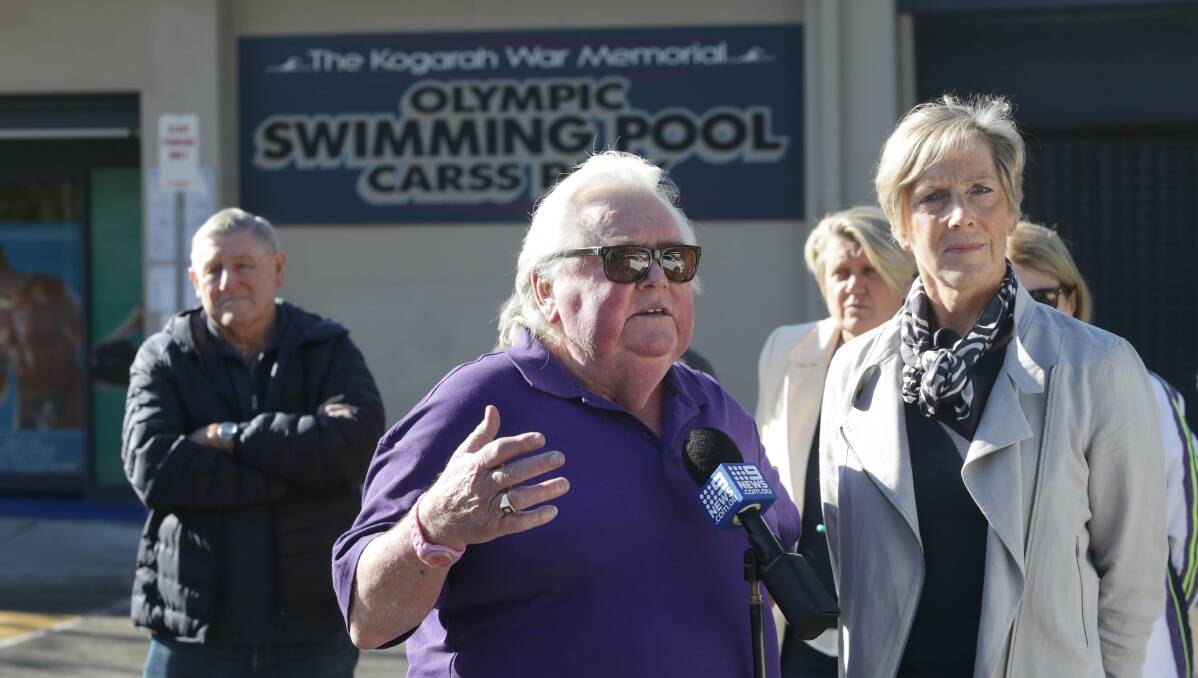 Contribution acknowledged: Dick Caine outside Kogarah War Memorial Olympic Swimming Pool last month with Olympian Michelle Ford who he trained. Picture: John Veage