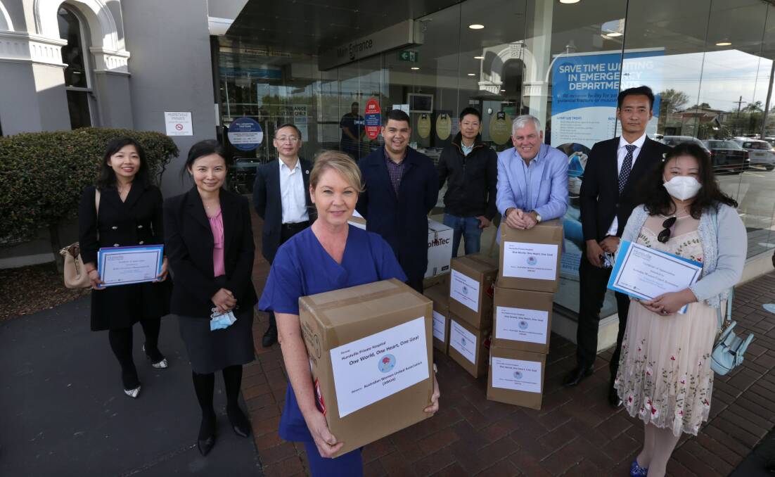Georges River Council mayor Kevin Greene (third from right) and Councillor Christina Wu, (second from left) led a delegatoin of members of the Chinese and Korean communities to present a donation of medical supplies to Hurstville Priveate Hospital. Picture: John Veage