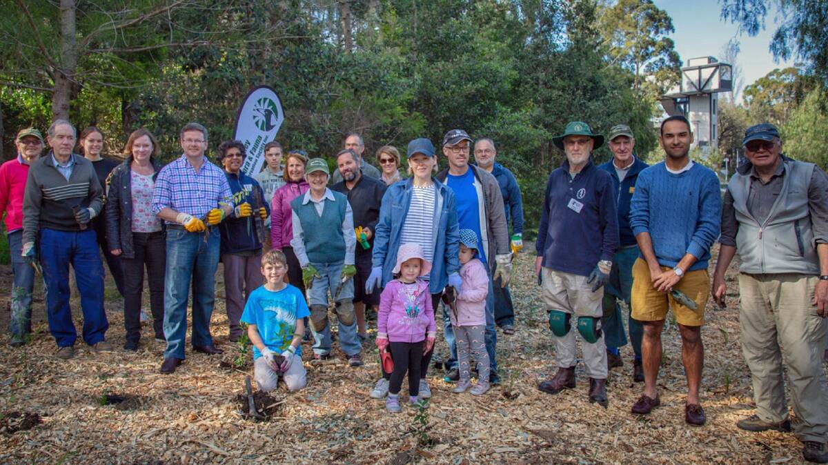 Restoring nature: Oatley MP, Mark Coure (fifth from left) with members of the Oatley Flora and Fauna Conservation Society at the River Road Reserve last Sunday.