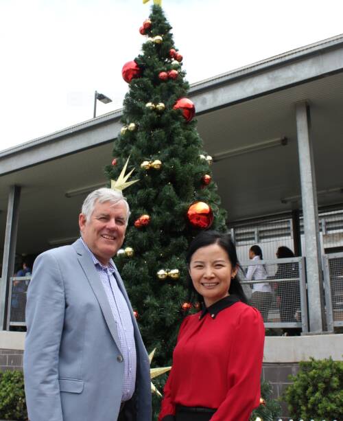 Getting into the Christmas spirit: Georges River Council Mayor Kevin Greene and Councillor Christina Wu at the community Christmas tree on Forest Road, Hurstville