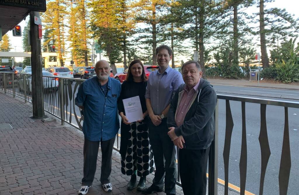 From left, Brighton-Le-Sands Chamber of Commerce's Robert Nacson and Peaceful Streets Action Group founder Heidi Douglas present their 2,500 signature petition to Bayside Councillors Ed McDougall and Bill Saravinovski.