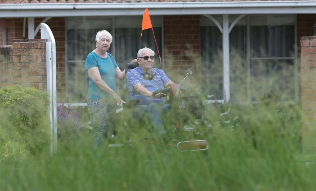Safety concerns John and Rosemary Willis regard the grassy median strip outside their home on Port Hacking Road, Miranda before it was mowed.Picture: John Veage