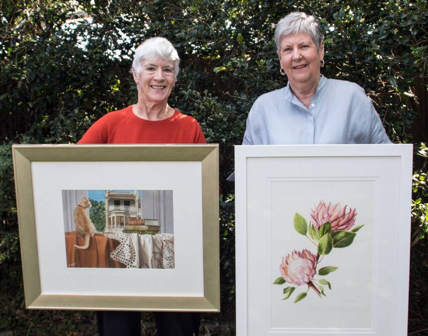 Brush with talent: Oatley Society of Artists treasurer Freda Surgenor (left) and president Jill Hamilton prepare for their Christmas exhibition.