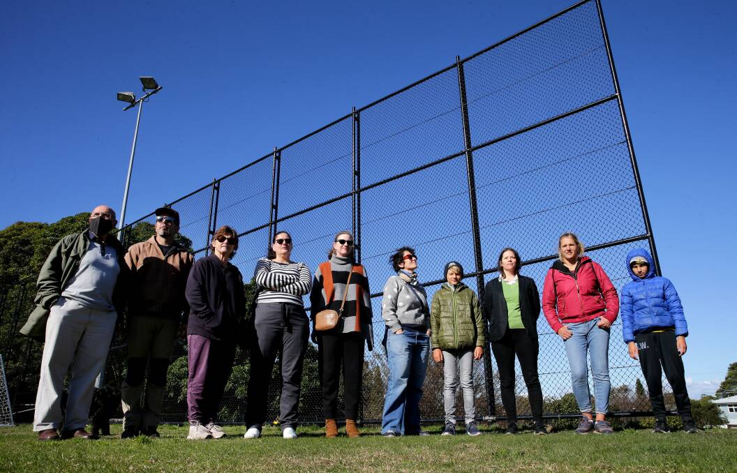 Gardiner Park residents with the fence that Bayside Council has refused to remove. Picture: John Veage