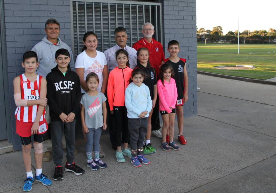 Upgrade completed: Members of the St George Little Athletics Centre together with Georges River Councillor, Con Hindi (back row second from right), inspecting the recently upgraded Olds Park amenities building. 