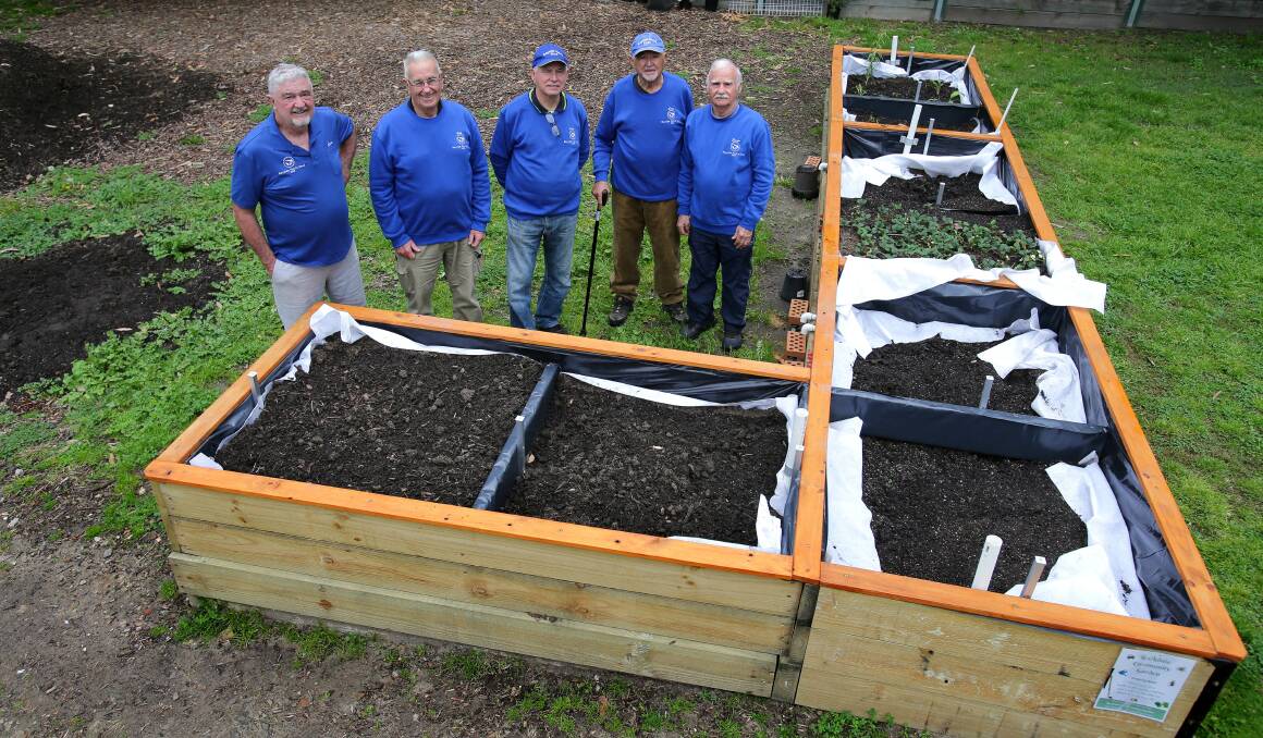 Digging in: Bayside Men's Shed members at the new Rockdale Community Garden, from left Steve, Oscar, Fred, Louis and George. Picture: John Veage