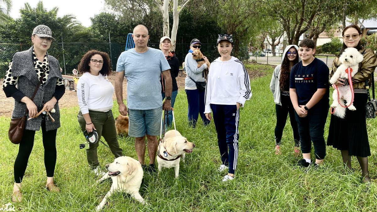 Residents with Councillor Nancy Liu, centre, in Hurstville Park earlier this year showing their support for an off-leash dog area in the park's playgorund.