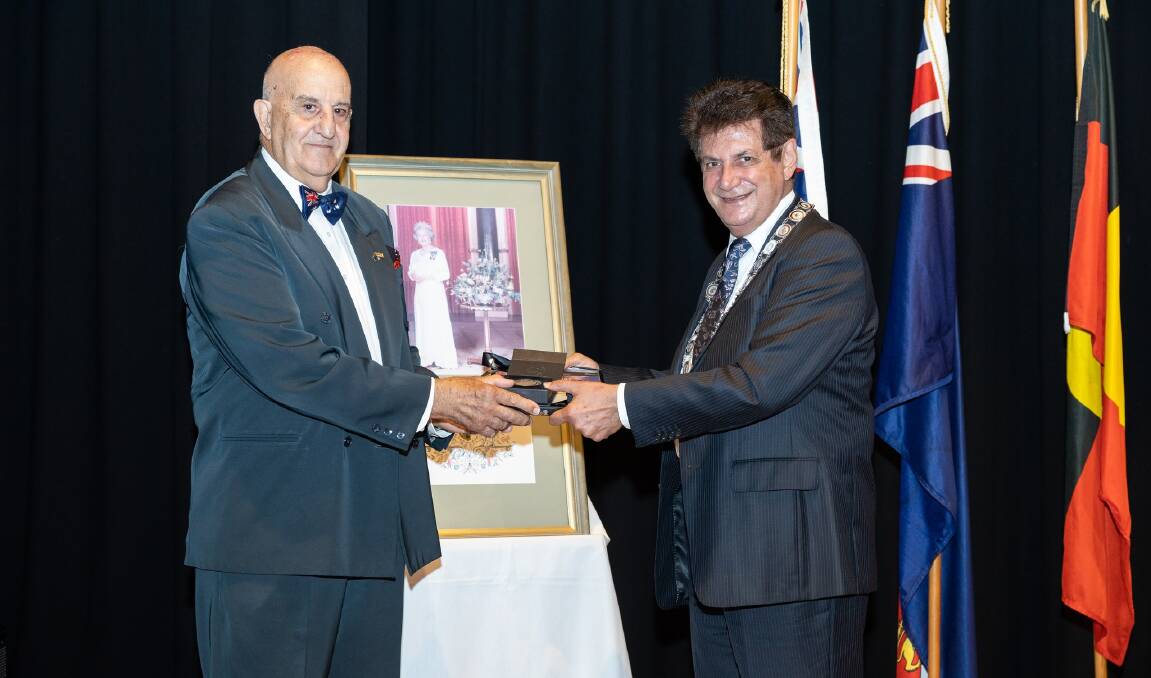 Ray Barbi receives his award from Georges River Council mayor, Nick Katris.