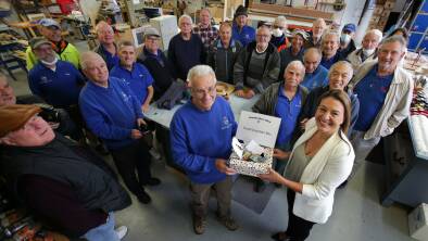 Bayside Council mayor, Dr Christina Curry with the members Bayside Men's Shed at Kyeemagh as they present the proceeds from their collection supporting flood victims. Picture: John Veage 