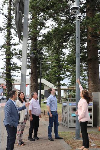 Here's looking at you: from left, Councillors Paul Sedrak, Heidi Lee Douglas, Bill Saravinovski, Ed McDougall and Bayside mayor, Dr Christina Curry inspect one of the new hoon cams at Brighton-Le-Sands.
