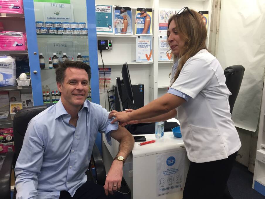 Community protection: Kogarah MP, Chris Minns received his vaccination from Nancy Gayed at Gilchrist Pharmacy, Bexley last Friday. Picture: Jim Gainsford .