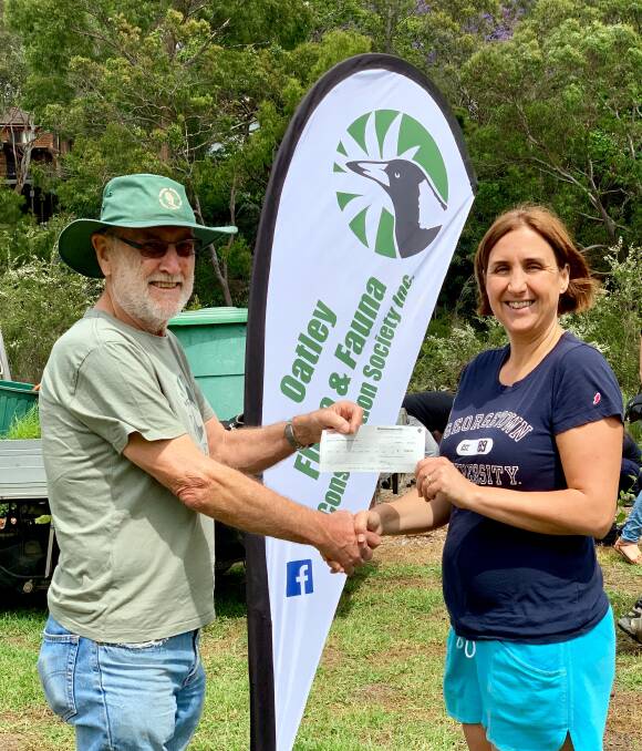 It's easy being Green: Oatley Flora and Fauna Conservation Society Inc. president Graham Lalchere received funding from Georges River Councillor Sandy Grekas which enabled bushcare volunteers to plant 500 plants in an hour.