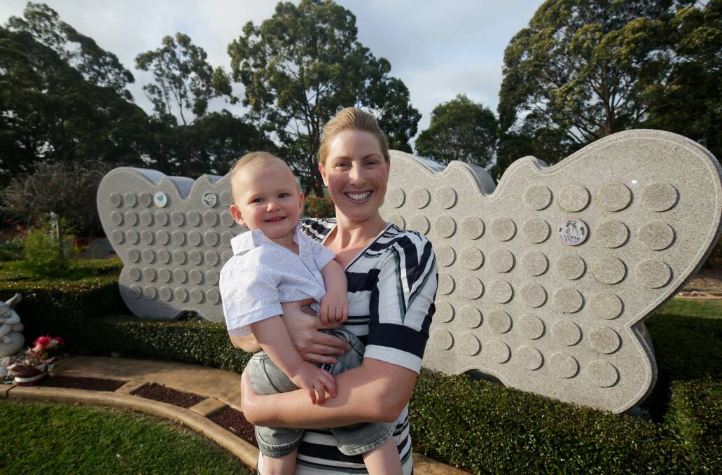 Time to remember: Shire mum Fallon Voroshine with her son Nash at the Karinya Garden in Woronora Memorial Park. Picture: Chris Lane