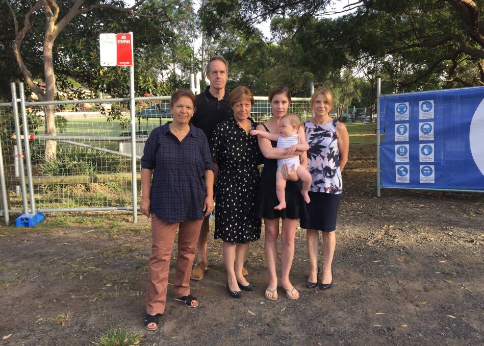 Talk to us: Parkside Drive residents with Sue Robinson, centre, outside the construction site at Charles Pirie Reserve.