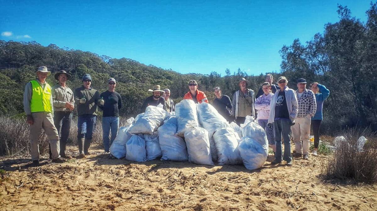 In the bag: Oatley Flora and Fauna Conservation Society members and the Oatley Kayak Crew with the bags of rubbish they collected in just four hours on Sunday.