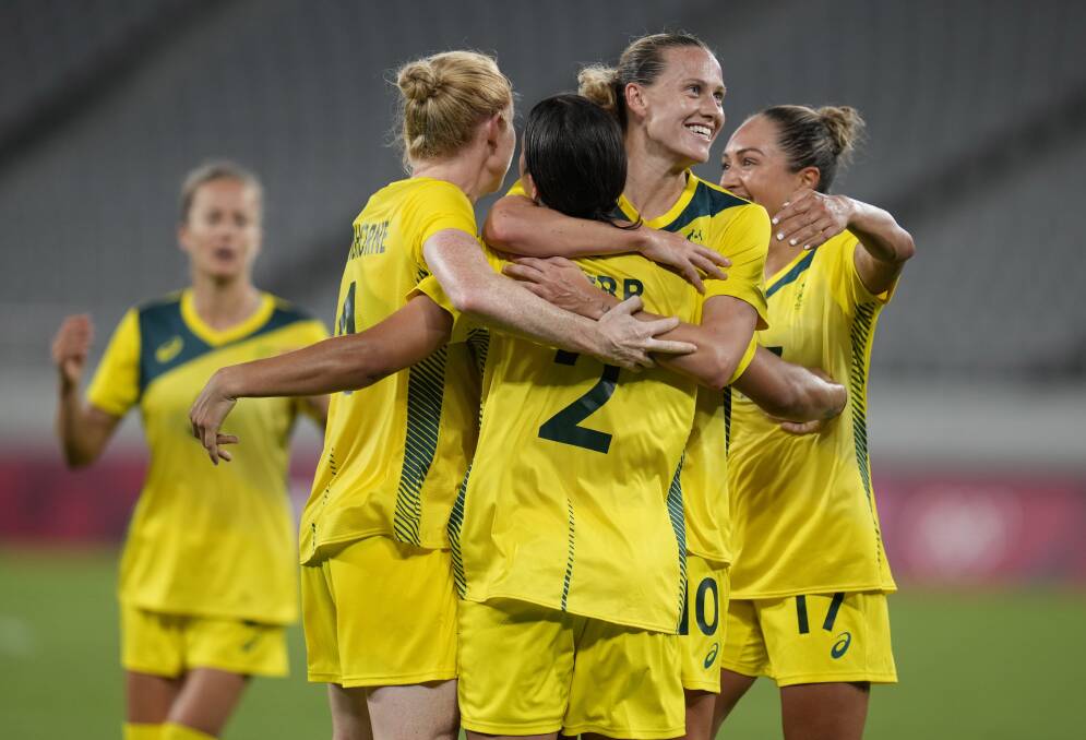 DELIGHT: Samantha Kerr (2) celebrates with her Matildas teammates after scoring against New Zealand on Wednesday night at Tokyo Stadium. Picture: AP Photo/Ricardo Mazalan 