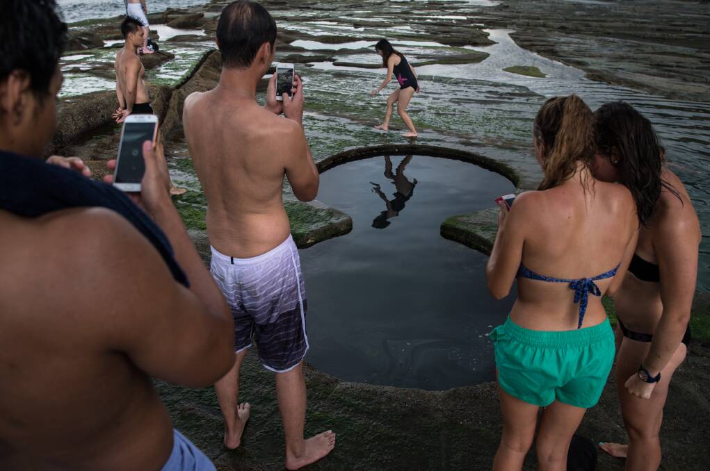 Visitors seek the perfect social media picture at the Figure Eight Pools. Picture: Wolter Peeters