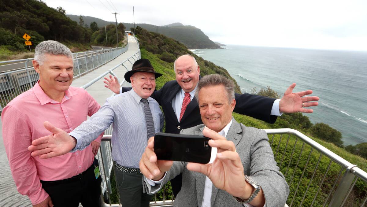 Postcard perfect: Wollongong City Council general manager David Farmer, Lord Mayor Gordon Bradbery, Heathcote MP Lee Evans and councillor Leigh Colacino took a selfie in front of the iconic Stanwell Park coastline. Picture: Sylvia Liber. 