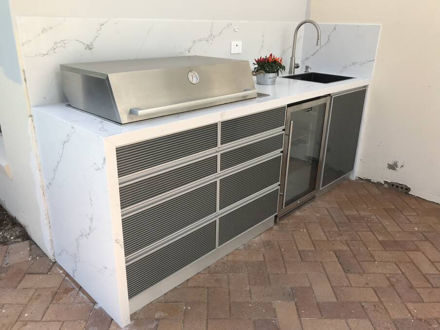 OUTSIDE AND IN: Granite Transformations offer customers the option of renovating an existing kitchen or having a complete new installation, whether it's an alfresco eating area, family kitchen, bathroom or laundry. 