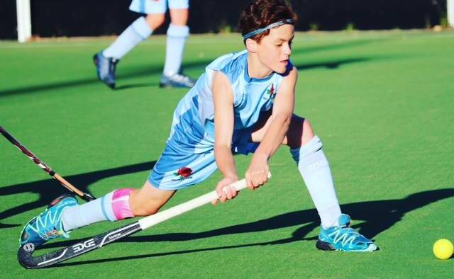 Victory: Kian Johnson captained the under-13s NSW hockey team to first place at the National Indoor Hockey Championships. Picture: Supplied