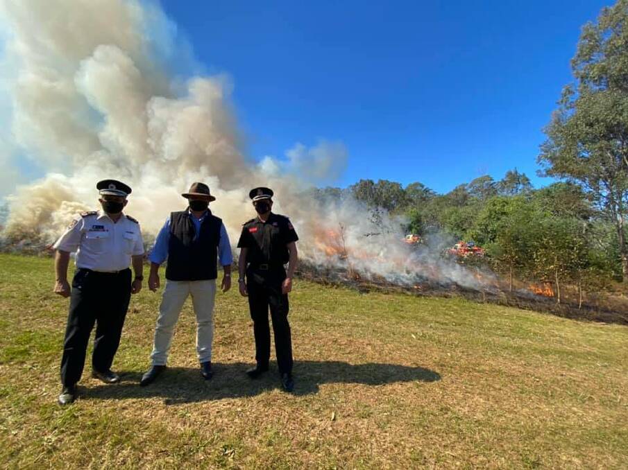 NSWRFS Commissioner Rob Rogers, Police and Emergency Services Minister David Elliott and FRNSW Deputy Commissioner Jeremy Fewtrell at Varroville on Wednesday.