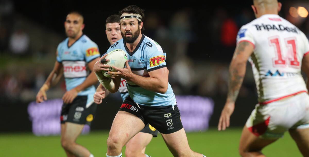 New club: Aaron Woods hits one up for the Sharks against the Dragons earlier this year. Picture: Chris Lane