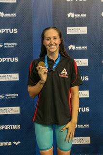 Madden with her gold medal at the Australian National Age Swimming Championships