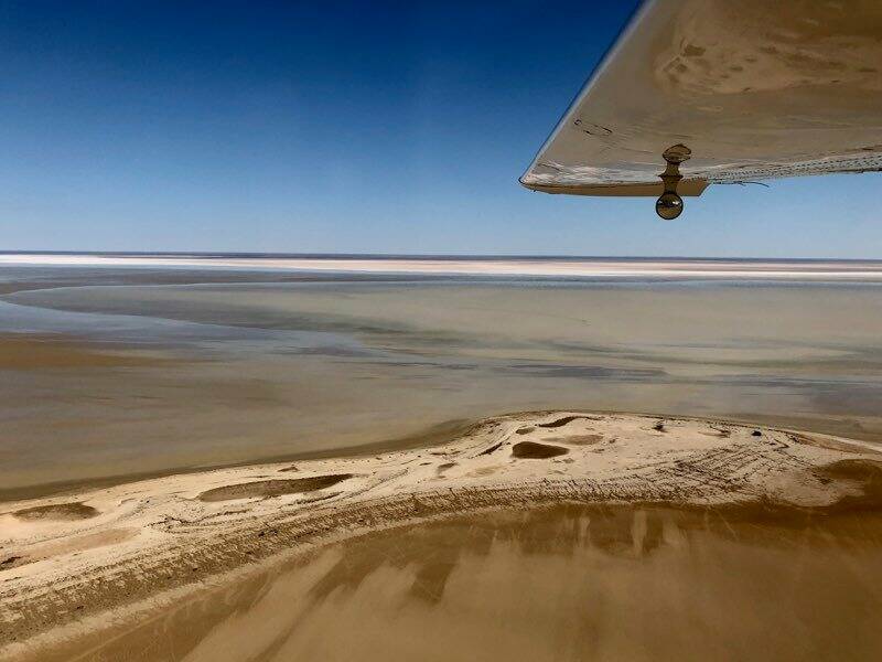 VAST^: The expanse of Lake Eyre has started filling as floodwaters make their way down the river systems to South Australia. Photo: Felicity Brown, Chinta Air