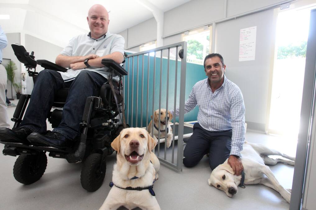A dog's life: Sutherland Shire mayor Carmelo Pesce (right) with Assistance Dogs Australia ambassador and client Tim McCallum. Picture: Chris Lane
