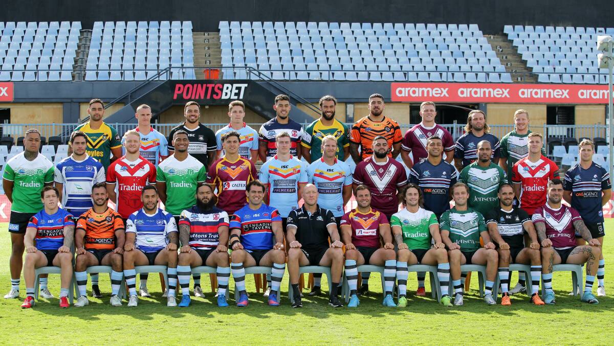 Local teams: The Cronulla Sharks NRL team shows its support of the local Junior League at their annual team photo this week. Picture John Veage