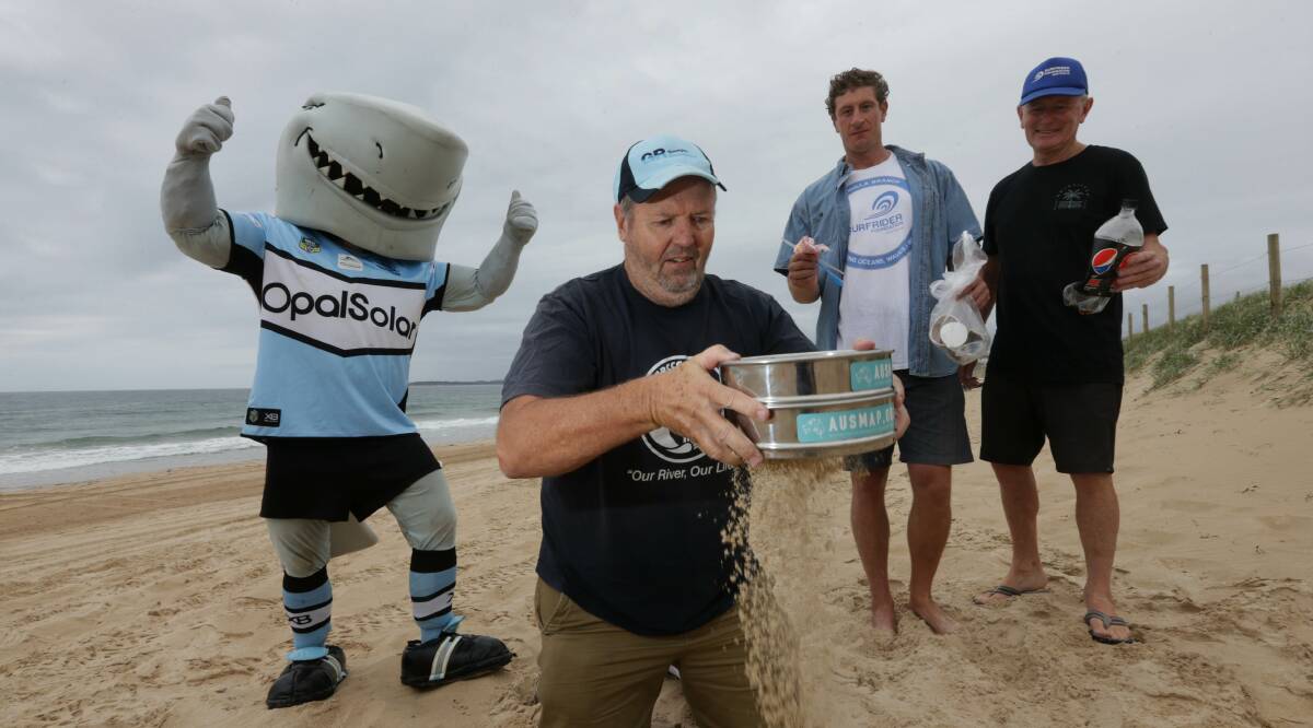 Cleaner Oceans:Riverkeeper Tony Wales does some Ausmap sand testing with Mr Sharkie on Wanda beach with Surfrider Foundations Joe Glendening and Andy Britton.Picture John Veage