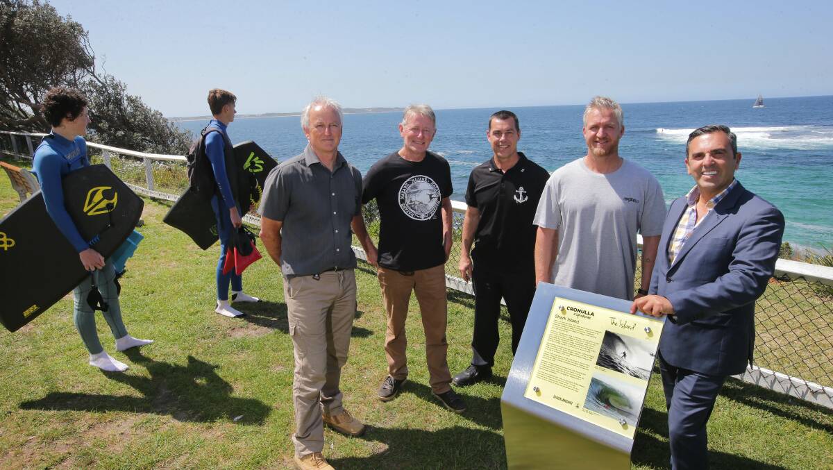 Its a sign: Mayor Pesce unveils the new Shark Island Surfing Reserve sign with stakeholders Tim Vanderlaan,Andy Britton,Brad Whittaker and Andrew Lester.Picture John Veage