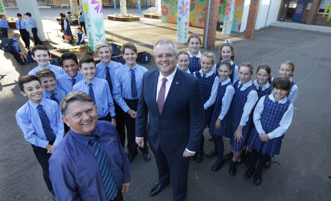 Coaching: Paul Crowther with Scott Morrison at St Aloyious school. Crowthers Bus company has been taking children to Canberra for decades. Picture: John Veage