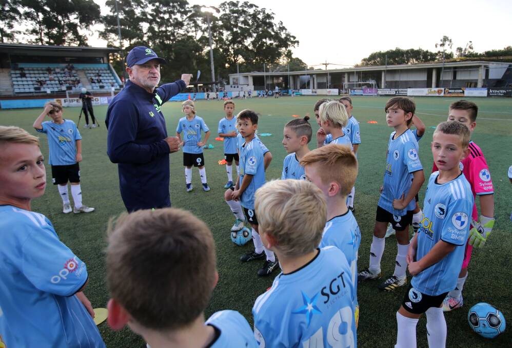 Good direction: Australian Socceroos coach Graham Arnold turned up to help at the Sutherland Sharks U10 training on Tuesday,thanks to Matthew Hartleys Qantas Frequent Flyer Points.Picture John Veage
