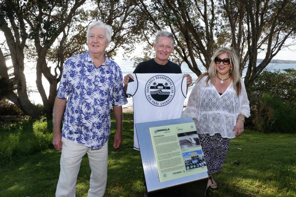 Surf signs: Deputy Mayor Michael Forshaw officially unveiled the Sandshoes plaque with Cr Marie Simone and Surfing Sutherland Shire's Andy Britton. Picture: John Veage