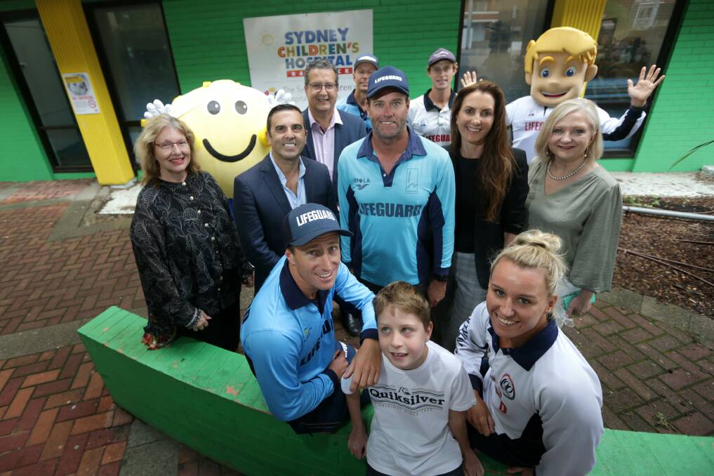 Support: Local hero Zane West is supported by the three Council Mayors and Lifeguards at Sydney Children Hospital.Picture John Veage