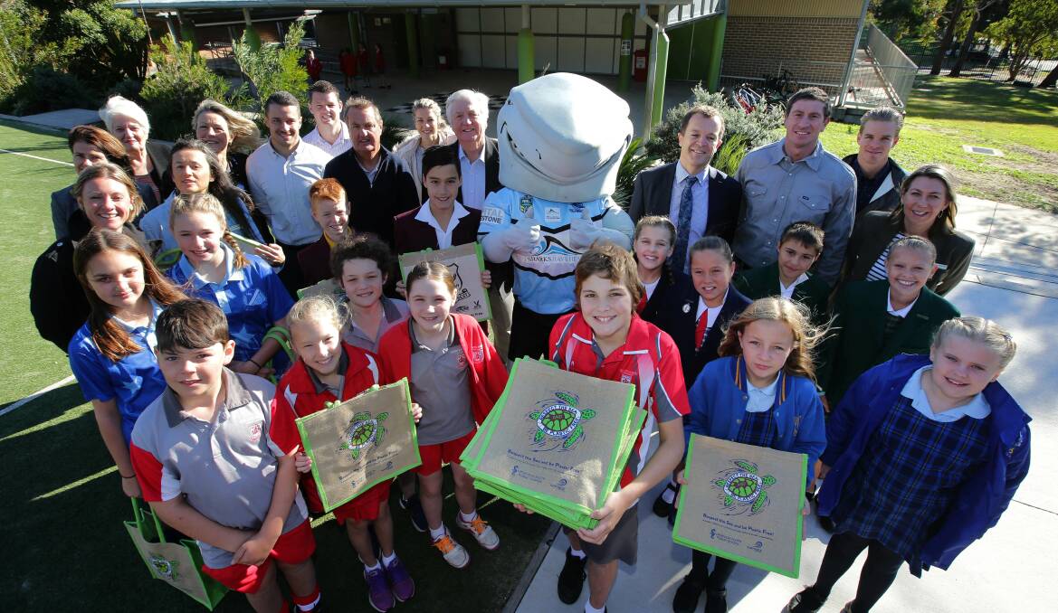 Plastic free: Luka Ford (centre) with his winning bag design with representatives from all the schools and organisations that have helped. Picture: John Veage