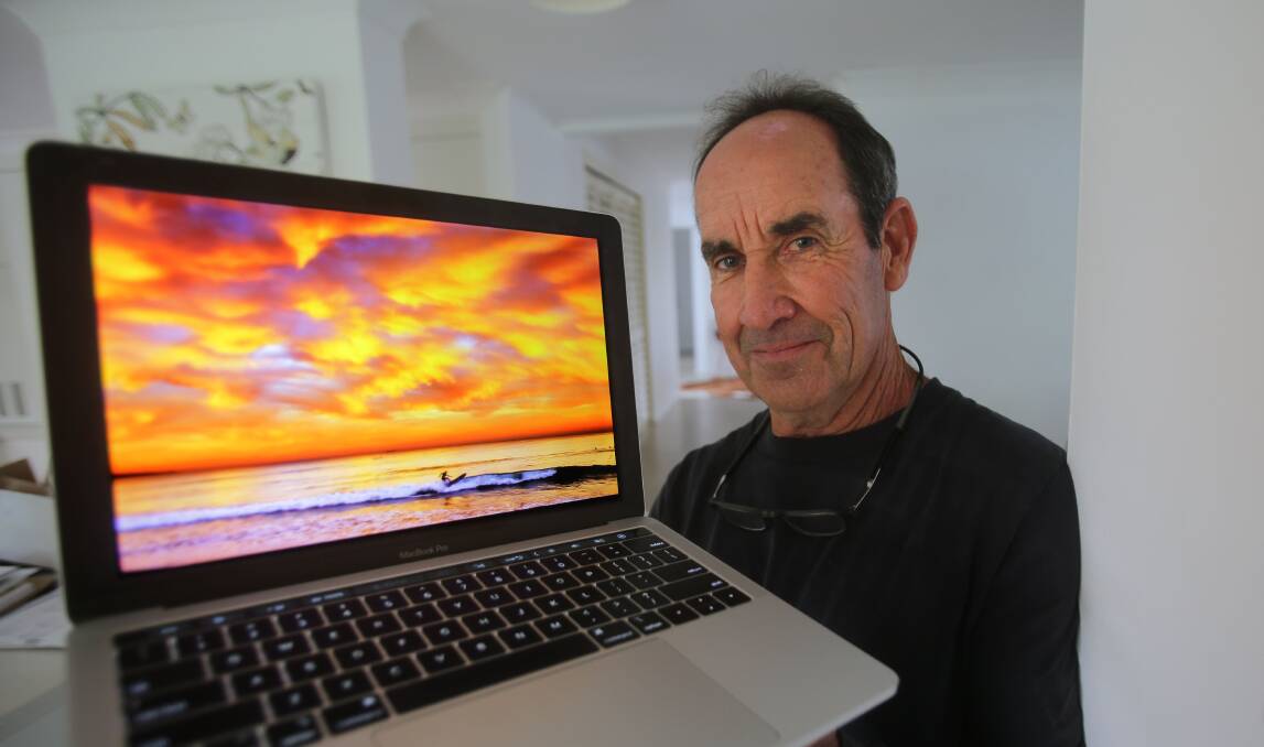 Colourful: Craig Golding at home showing his new Cronulla website display.Picture John Veage