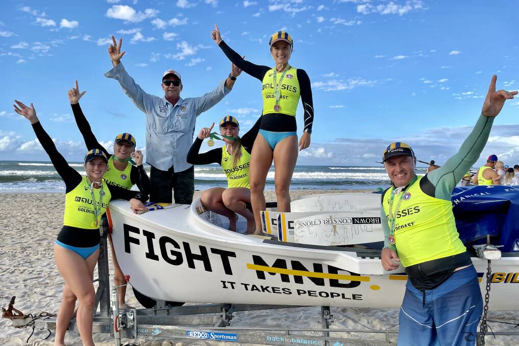 Gold medalists: The North Cronulla Open Women's crew celebrate with Sweep Mark McDonald and Boat Captain Michael Boffinger.