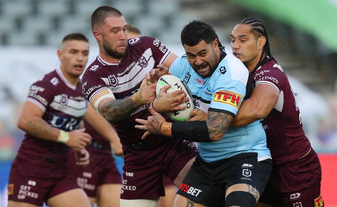 Big men:Andrew Fifita takes the ball up against for a famous victory.Picture NRL Imagry