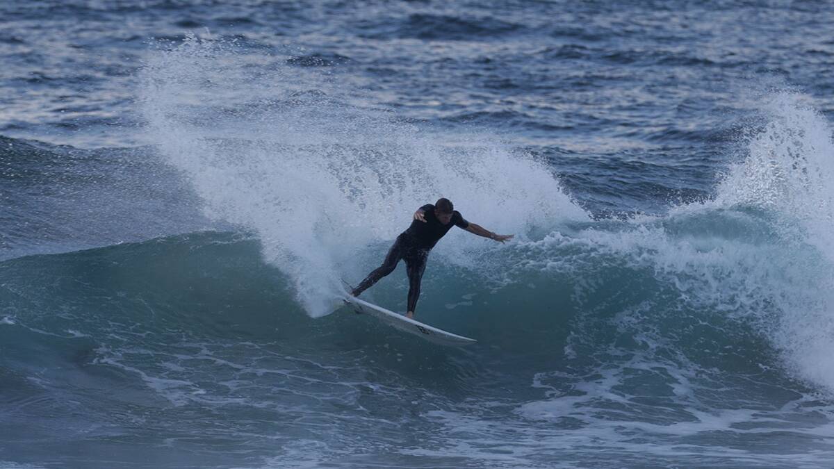 Matt Griggs makes the most of this mornings conditions at Nth Cronulla.Picture John Veage