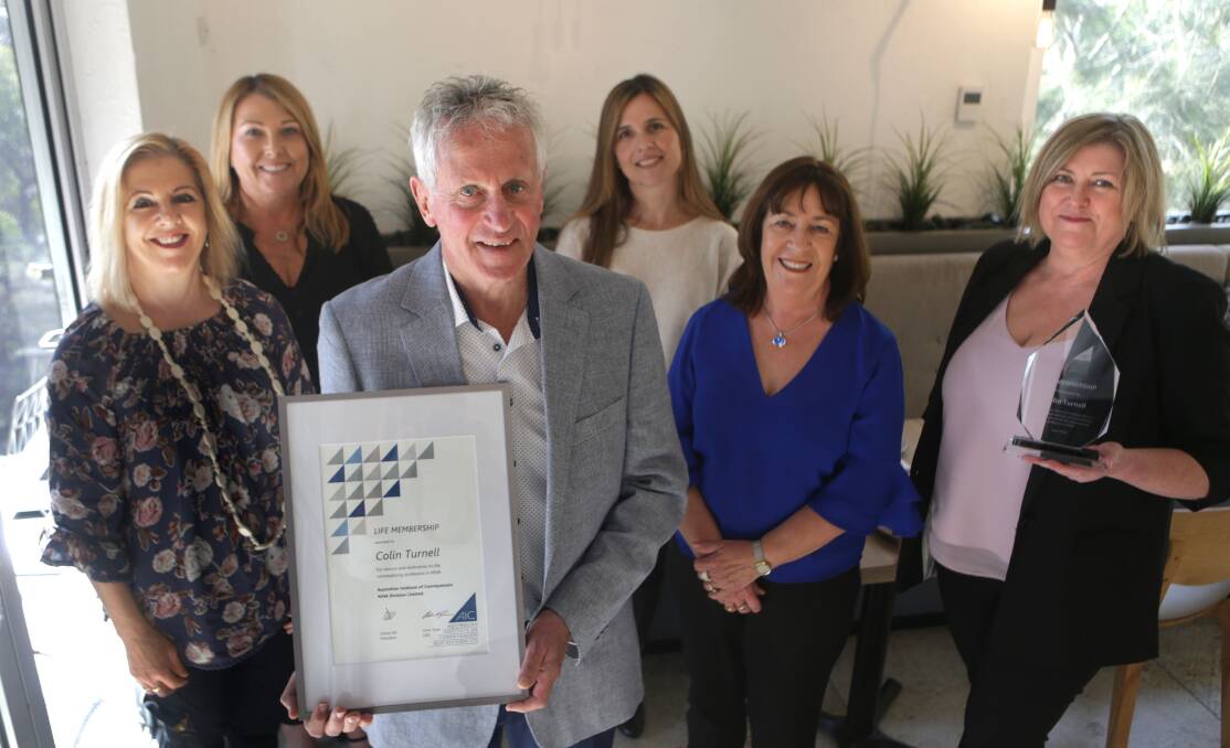Conveyancing:Colin Turnell with his staff Julie,Jennine, Kerrie-Anne and Aristea is awarded NSW Life Membership by President Cheryl Alt.Picture John Veage