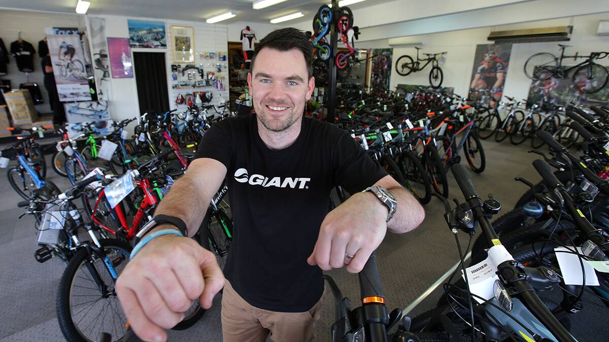 Advice : Chris CJ Sutton at work in the Bates Bikes shop on the Princes Hwy Carlton.Picture John Veage