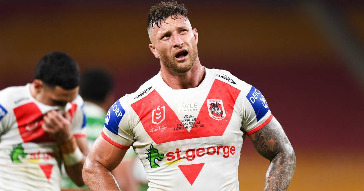 Red V: Captain Tariq Sims wears the famous Dragons jersey with pride.