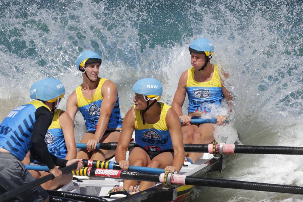 NSW team: One of the North Cronulla men's teams battle the surf at Elouera Beach last year. Picture: John Veage