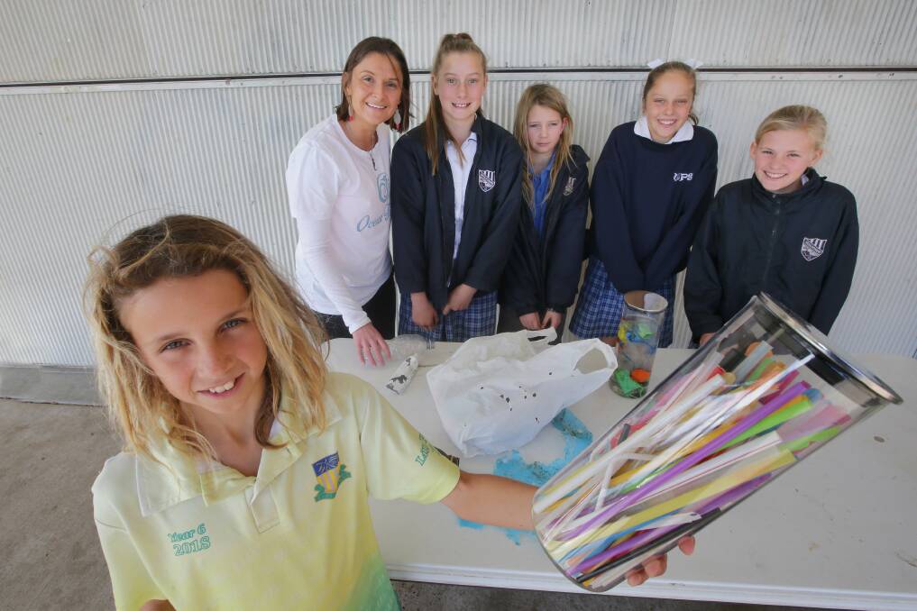 Last straw: Zai Brown with Sarah-Jo Lobwein and senior Woolooware students Ella, Archie, Giselle and Pipi. Picture: John Veage