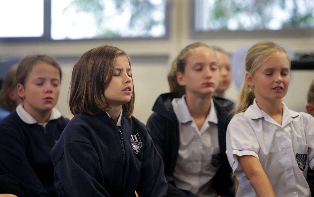 Concentrate and relax: Woolooware Public School year 5/6 students focus on the positives of life. Picture: John Veage