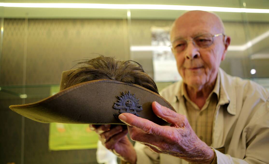 Emu plumes: RSL Sub Branch member Cliff Horsley with the original Slouch Hat that was worn by his father Fredrick Horsley at the Light Horse charge at Beersheba during WW1. Picture: John Veage