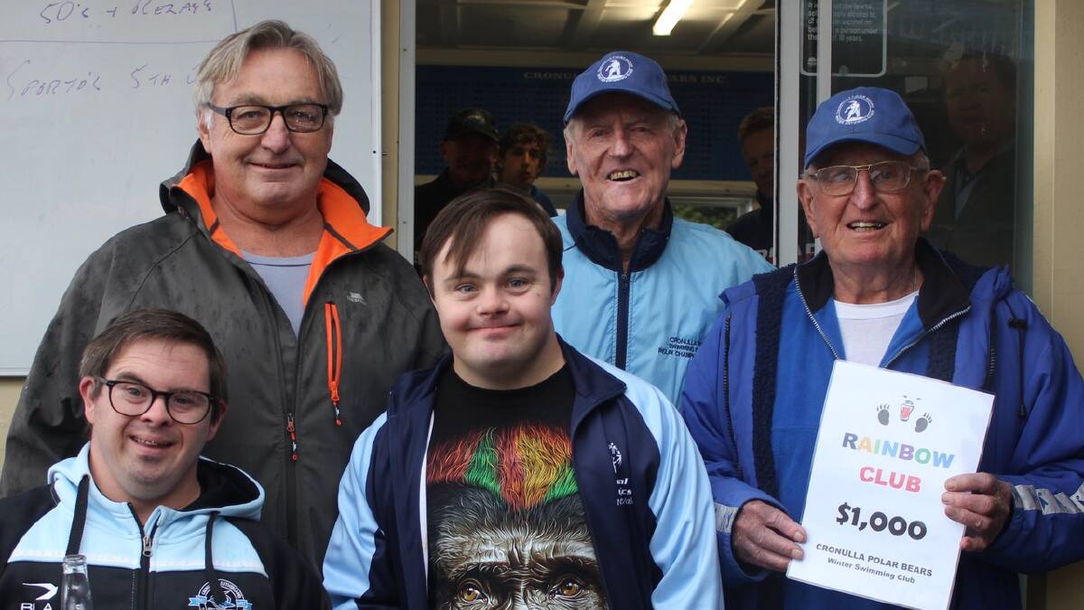 Winter raffles: The Cronulla Rainbow Clubs John Taplin (L) with Alex and Michael are presented with a cheque from the Polar Bears Dennis Ford and John Suann.